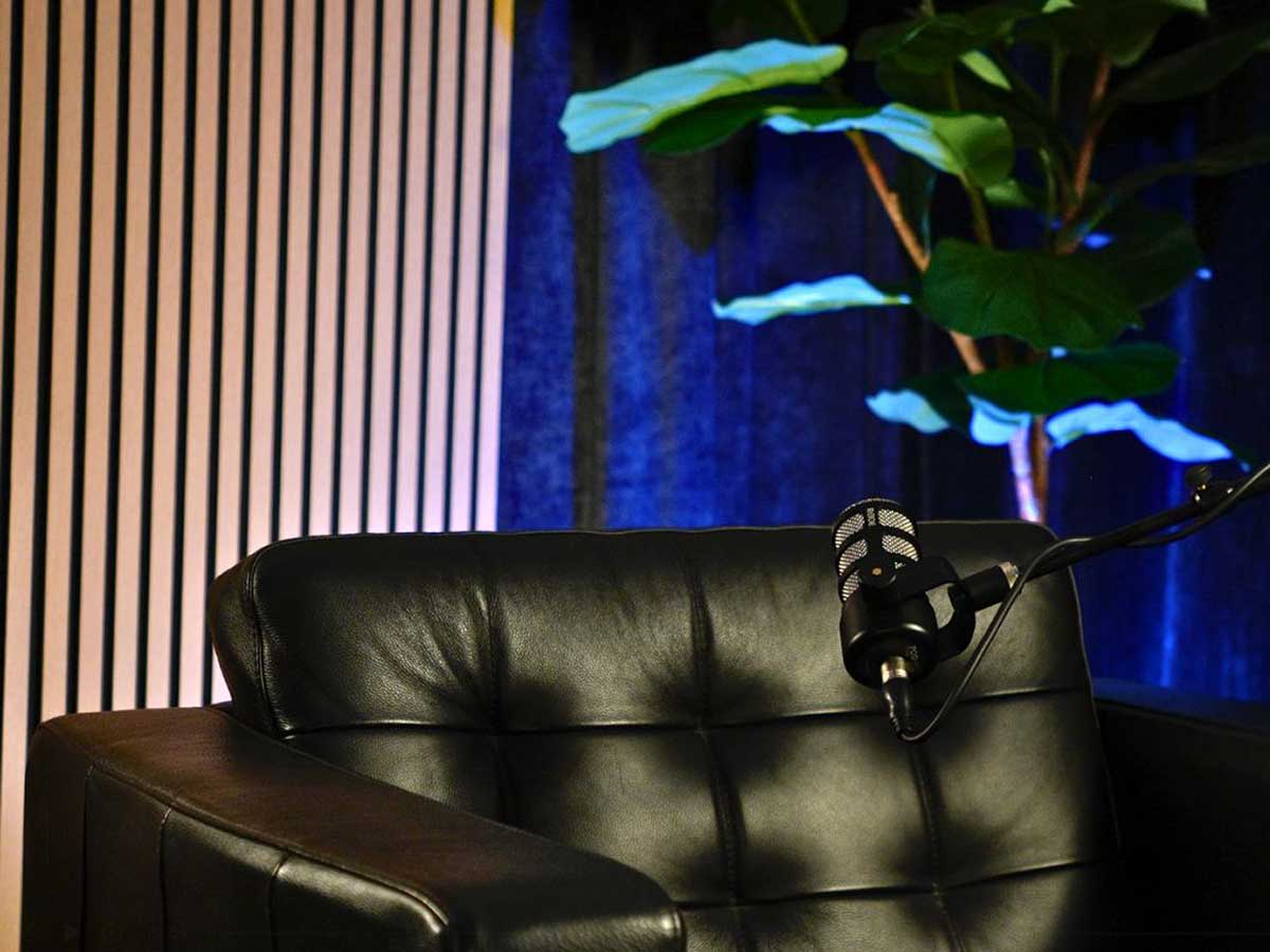 Empty solo set with slat background walls with blue backlight.